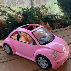 Barbie Pink Convertible with Two Dolls.